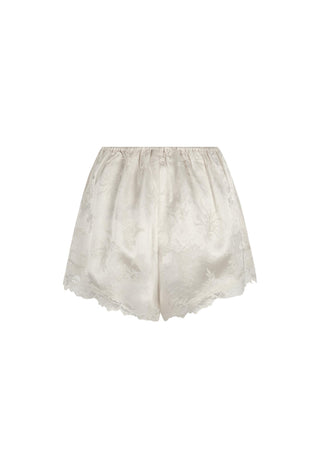 off-white-satin-shorts-with-a-subtle-floral-jacquard-pattern-and-a-delicate-lace-hem-shown-against-a-plain-white-background