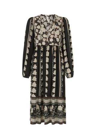 A long-sleeved midi dress with a black base and beige floral pattern, featuring a gathered waist and a patterned border at the hem, shown against a plain white background.