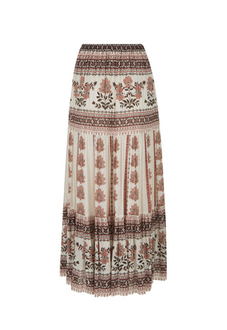 A bohemian-style pleated maxi skirt with a cream base and brown, terracotta, and black floral and geometric patterns, shown against a plain white background.